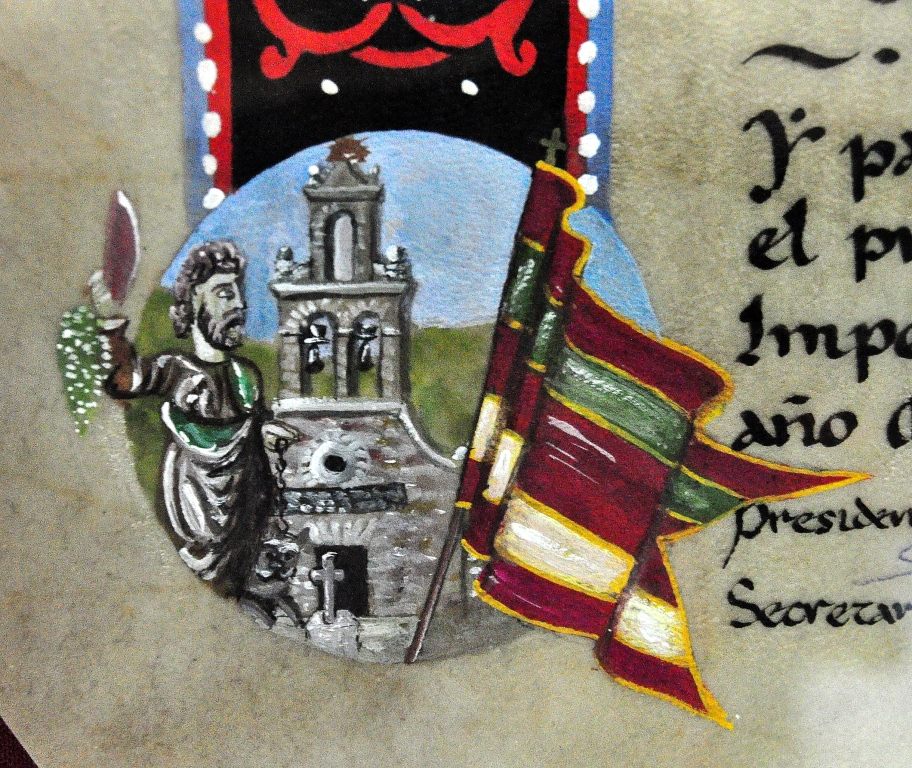 Detalle de la orla del pergamino de Valdefrancos, con su pendón, la iglesia y la imagen del patrón San Bartolo. (Pergamino Gordón El Escribano).